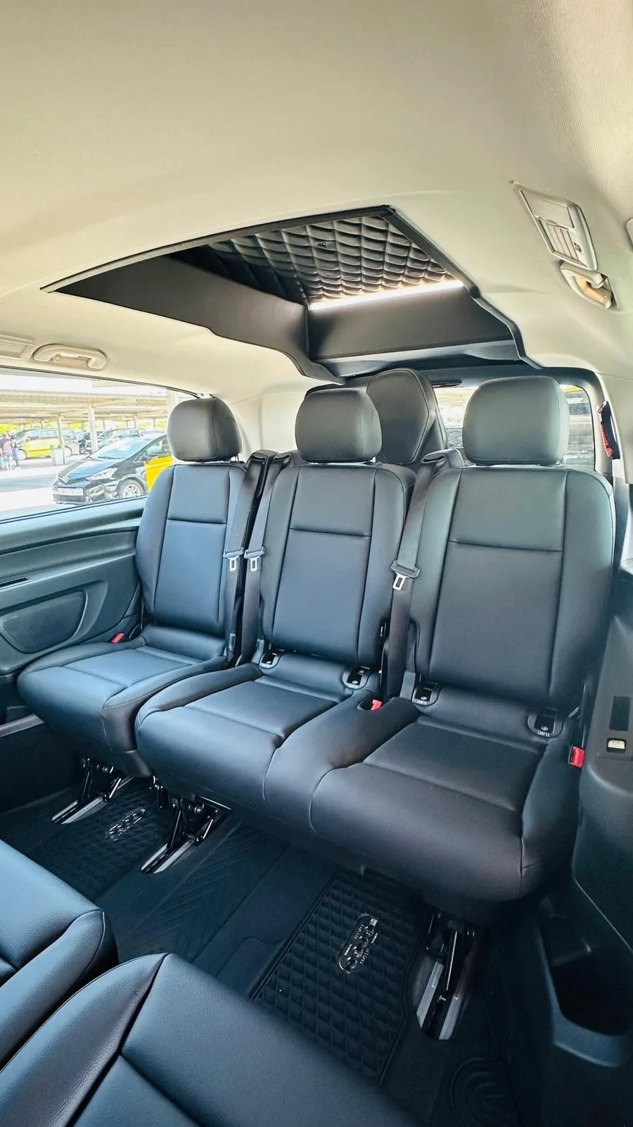 Spacious leather interior of the private transfer car